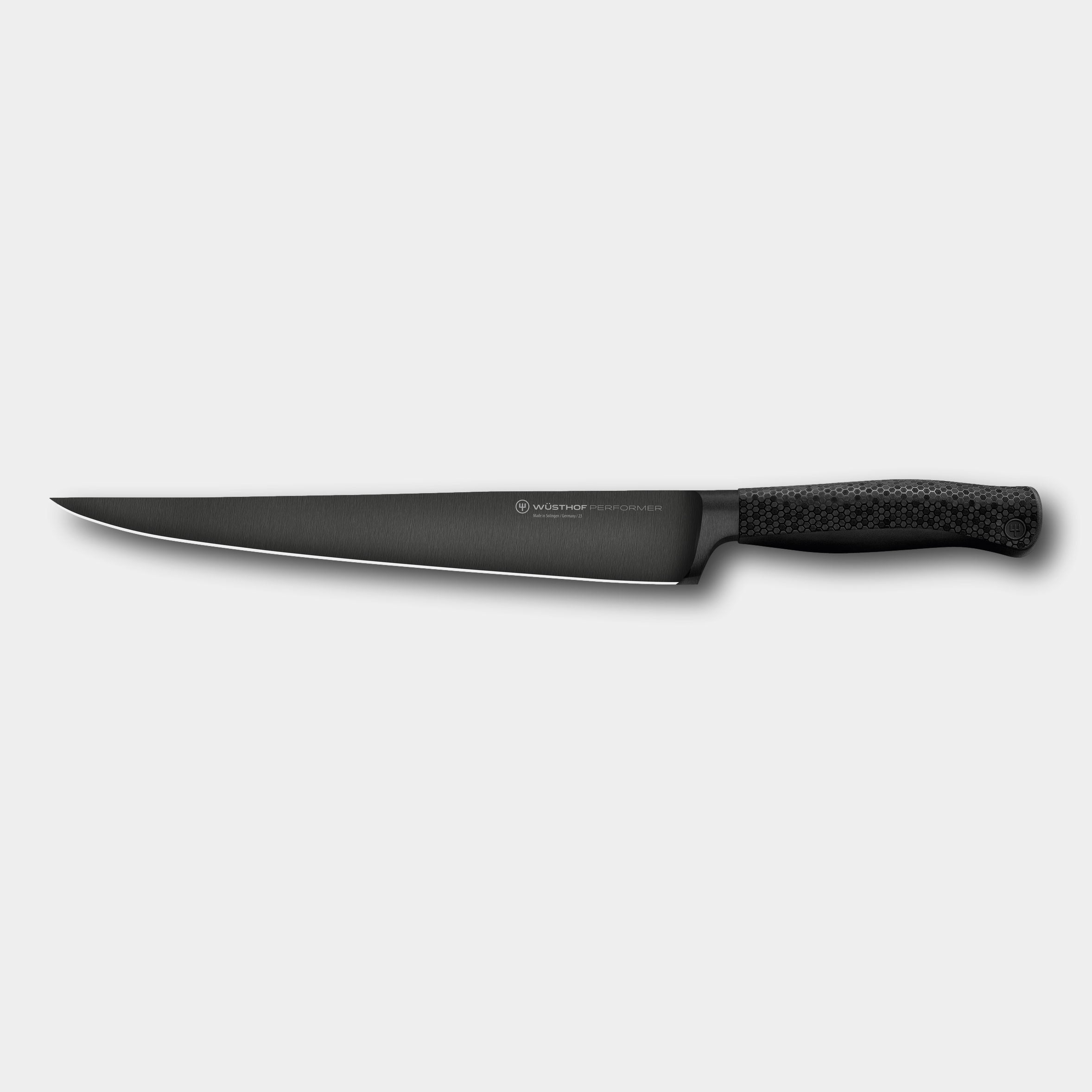 Wusthof Perfomer 26cm Carving knife with diamond like carbon coating and honeycombe handle by The Cotswold Knife Company.