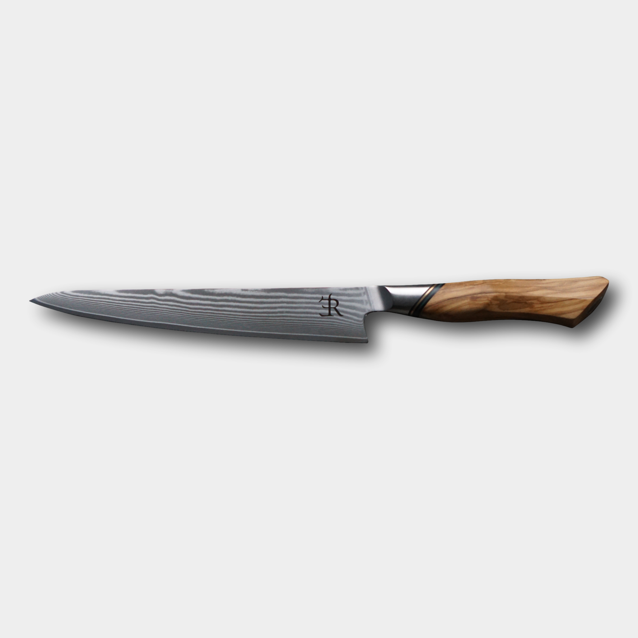 Ryda Knives from Sweden.  A73 Carving knife, Damascus blade with ultimate comfort French Olivewood handle.  Supplied by The Cotswold Knife Company.